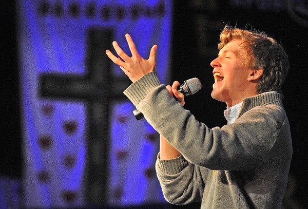 An emotional Jessie Brodka, of St. Benedict Church, sings Now God, a song he co-wrote with Charlie DeRose, of St. Francis of Tonawanda, at the Adams Mark Hotel Grand Ballroom during the final day of the 65th Annual Diocese of Buffalo Youth Convention. (Dan Cappellazzo/Staff Photographer)